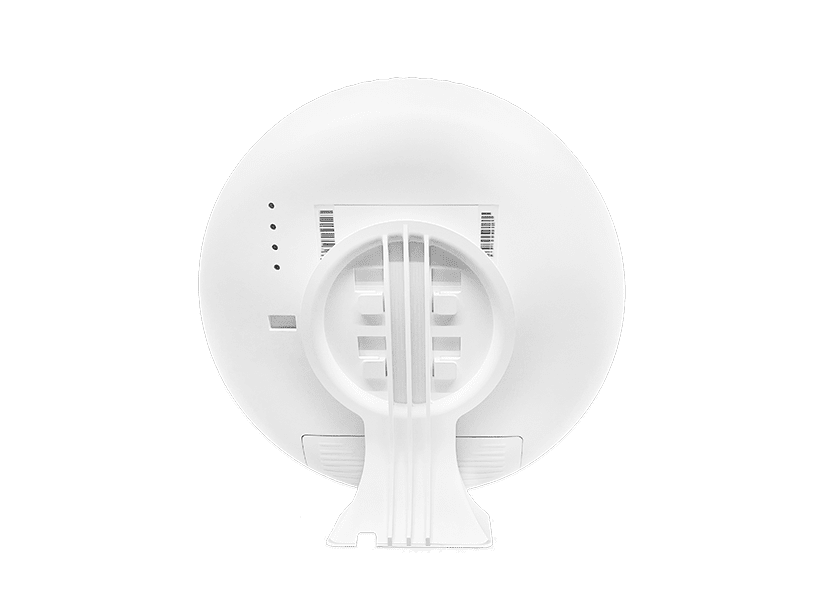 The back view of a white, circular FlexPro 5G router, showing its integrated stand, ventilation slots, indicator lights, and a barcode on a black background.